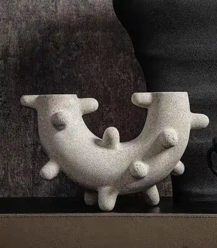 Curved Cylindrical Sculpture with Elongated Spheres