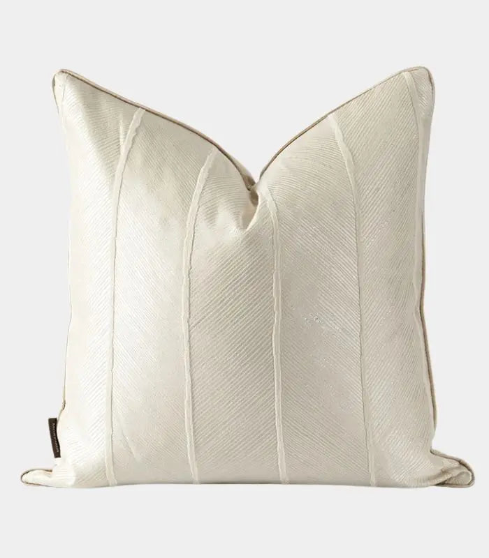 A rectangular decorative cushion cover with a textured stripe design in beige and gray tones.