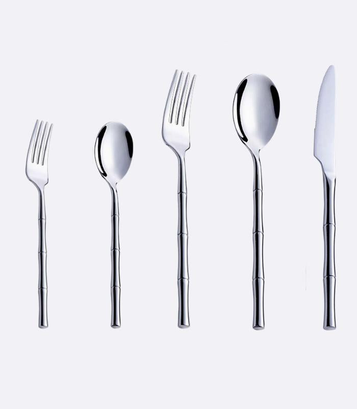 A set of stainless steel cutlery with bamboo-inspired handles, including knives, dinner spoons, forks, teaspoons, and small forks, displayed against a white background.
