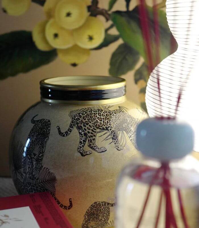 Handcrafted porcelain vase in safari style by Last Aristocrat company, featuring intricate animal print designs in earthy tones